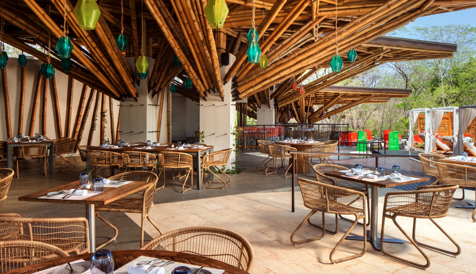 Bamboo-themed outdoor restaurant seating.