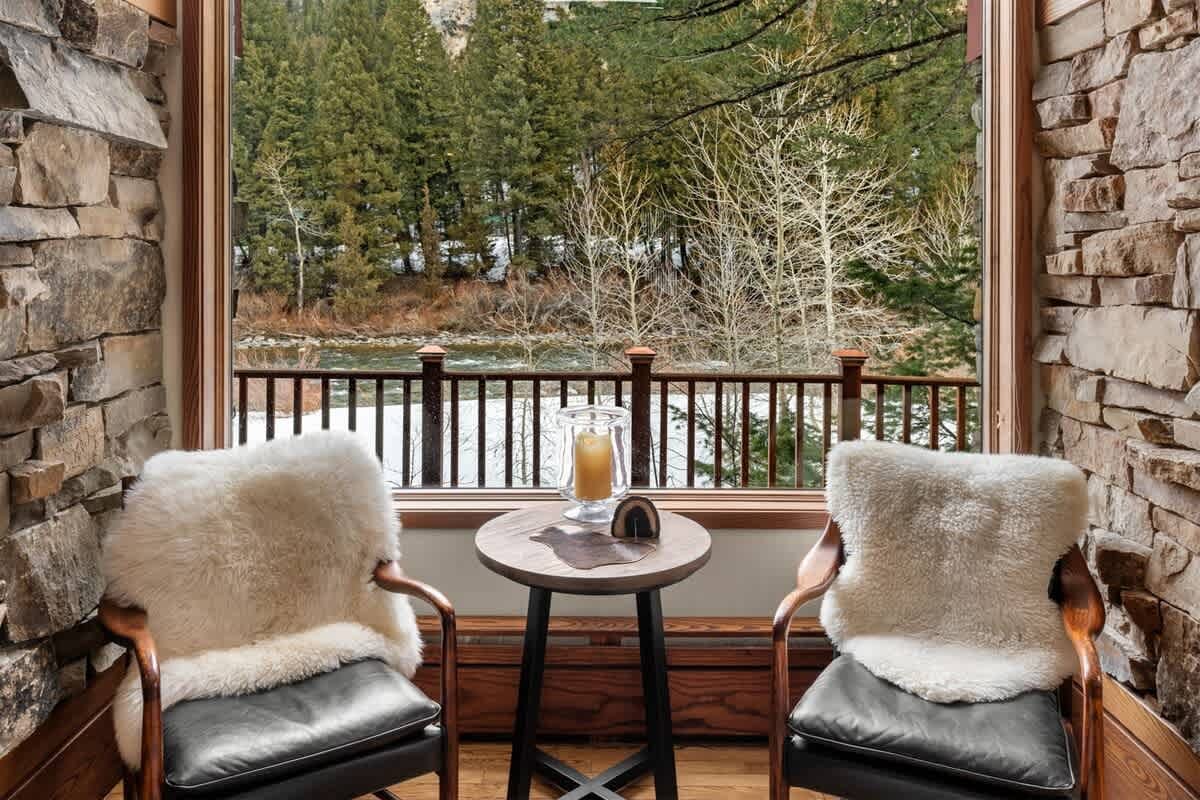 Cozy chairs, nature view outside.