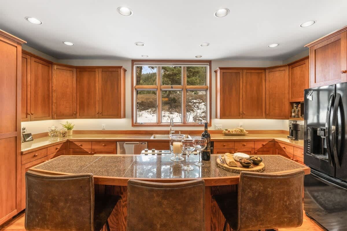 Warm wooden kitchen with island.