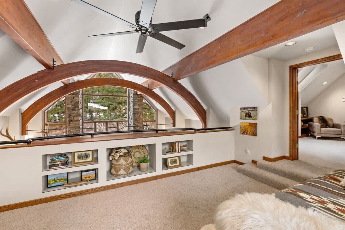 Loft with arched wooden beams.