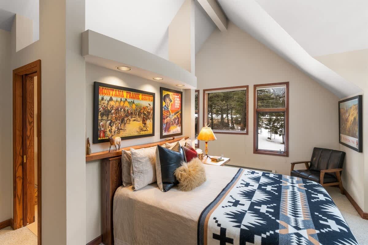 Cozy bedroom with decorative posters.