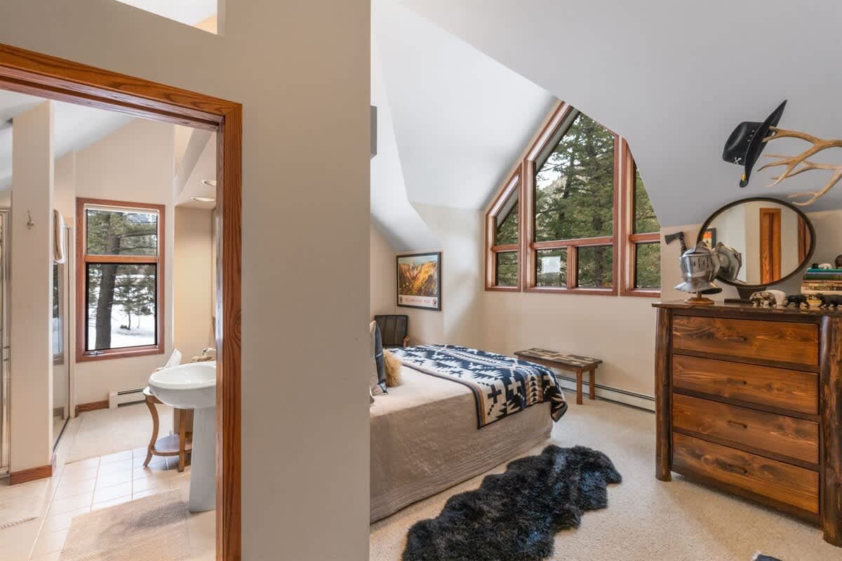 Cozy bedroom with large windows.