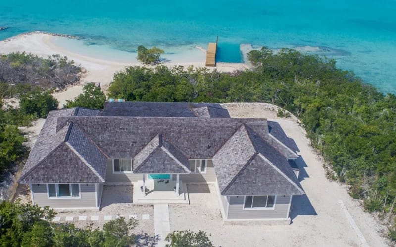 Beachfront house with turquoise water.