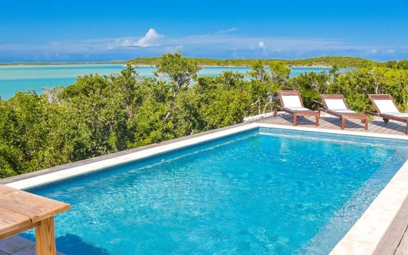 Poolside overlooking beach and ocean.