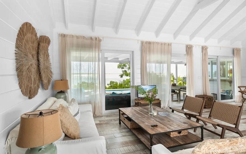 Coastal-themed living room with patio.