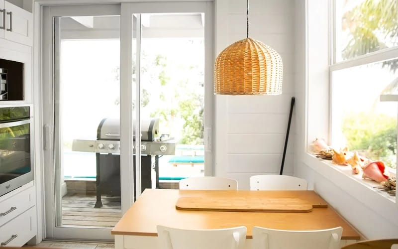 Kitchen nook with wicker lamp.