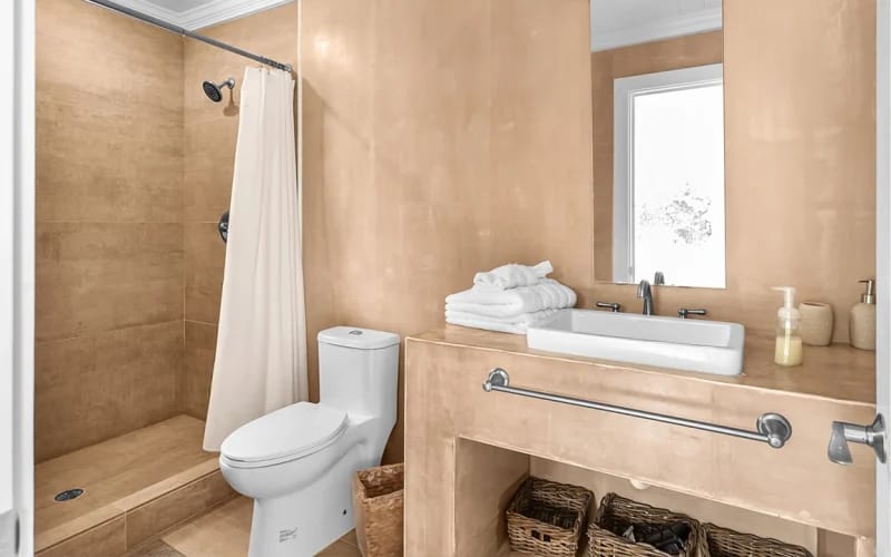 Minimalist bathroom with shower area.