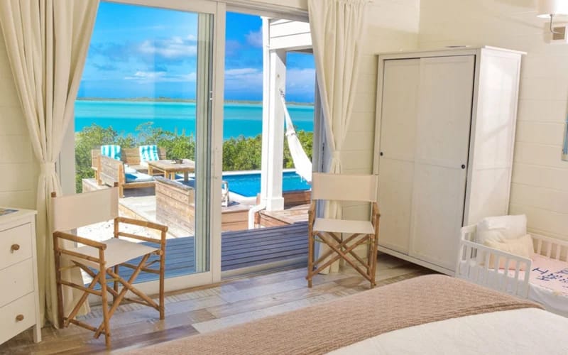 Bedroom with ocean view balcony.