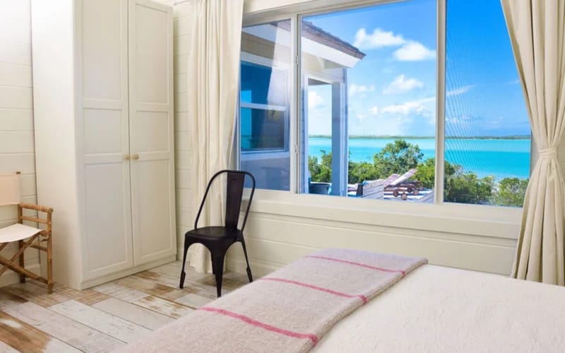 Bright bedroom with ocean view.