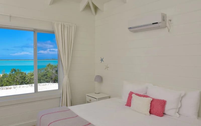 Bright bedroom with ocean view.