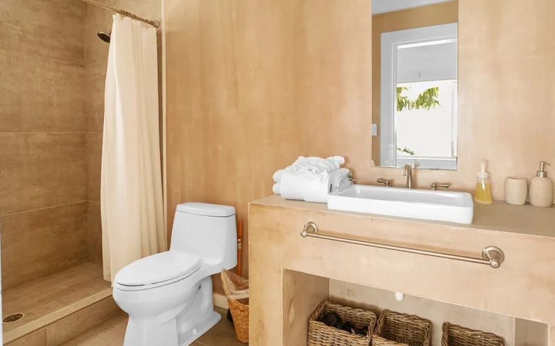 Minimalist bathroom with shower and sink.