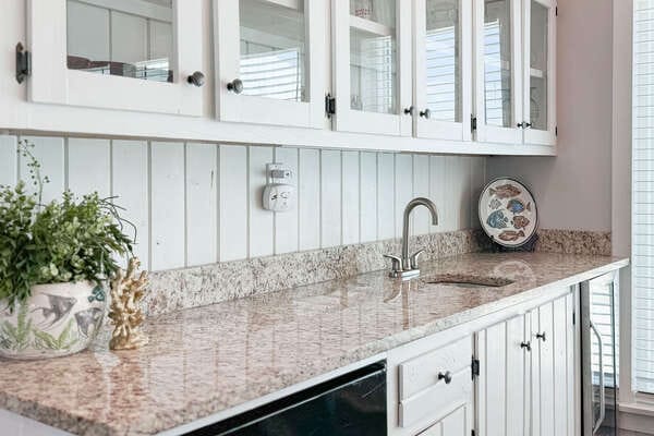 White kitchen cabinets and counter.
