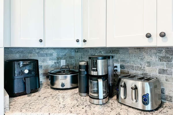 Kitchen counter with various appliances.