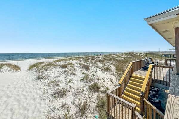 Beach house with sand dunes.