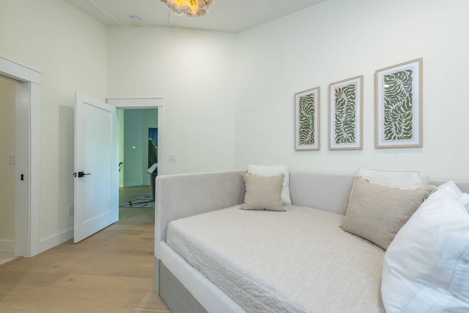 Minimalist room with framed artwork.