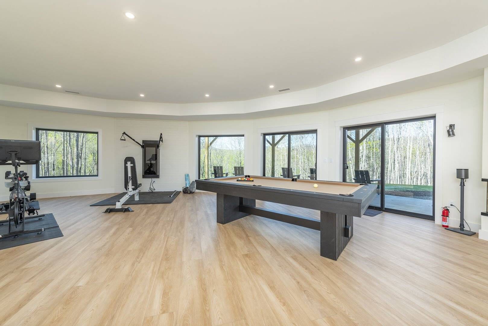 Game room with gym equipment.