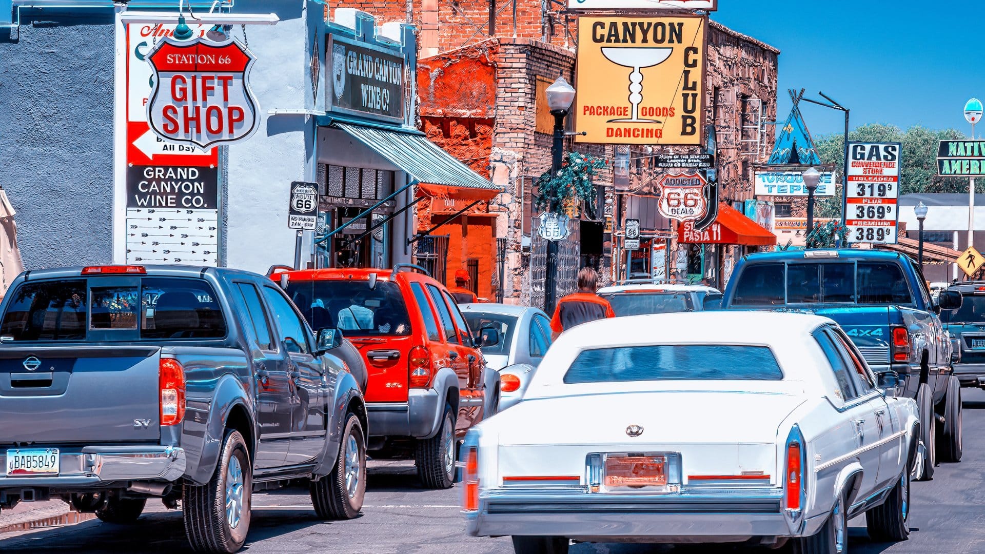 Busy street with vintage signs.
