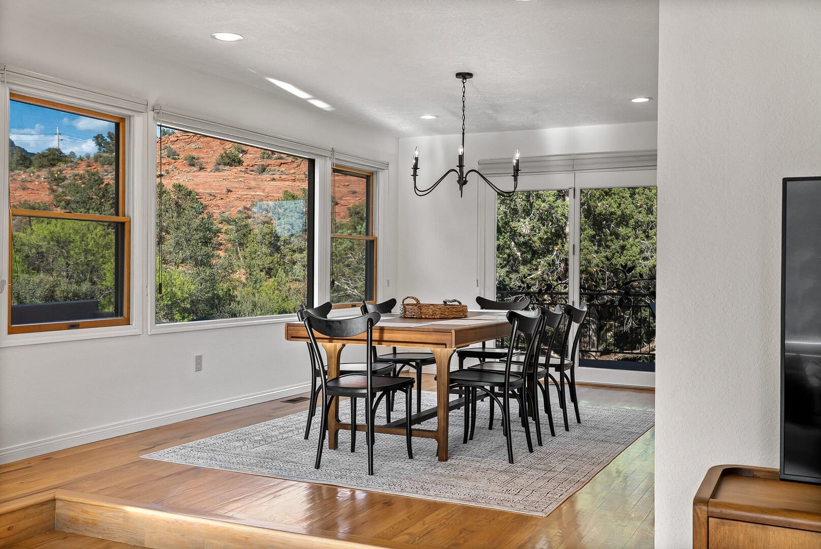 Modern dining room with landscape view.