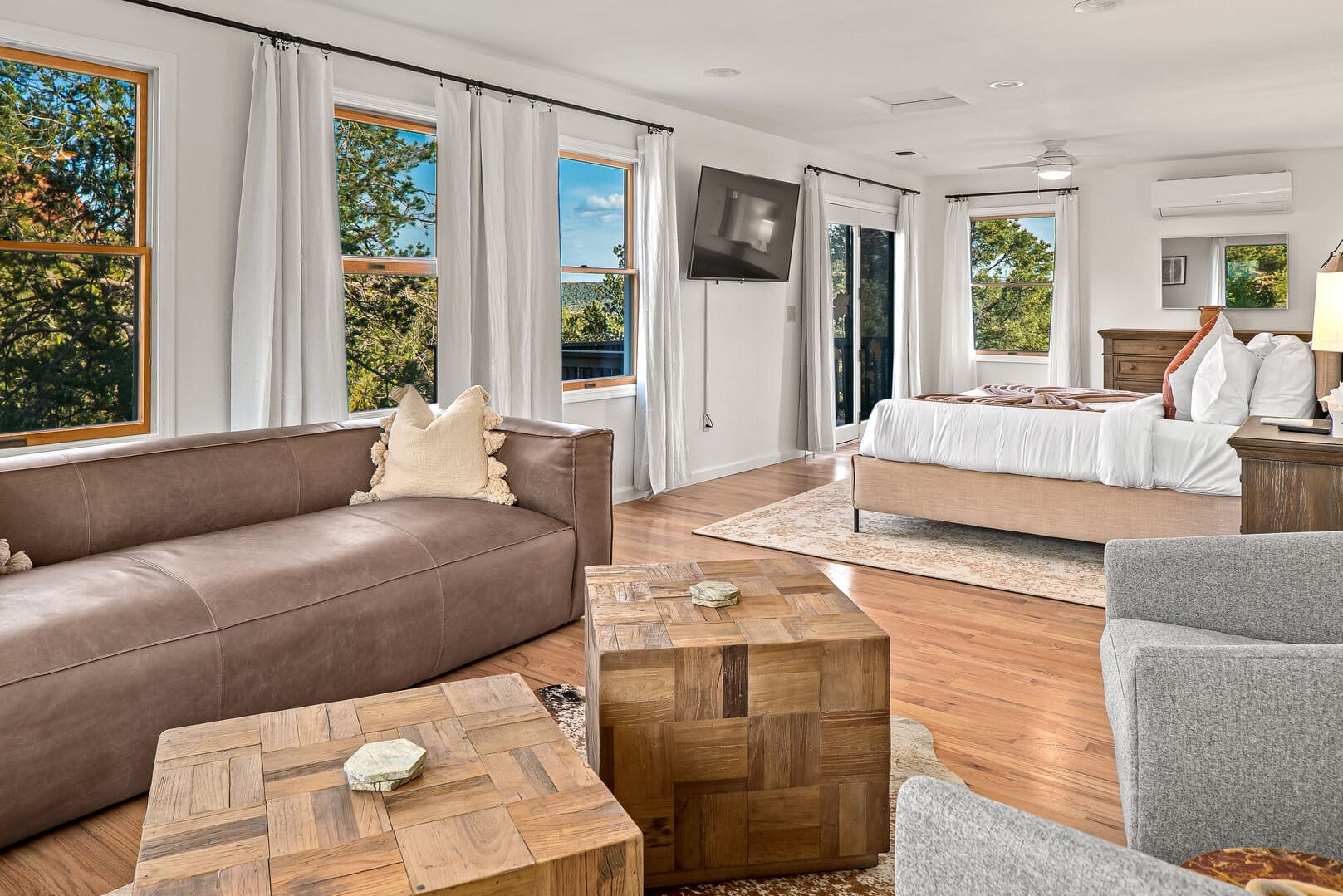 Spacious, bright bedroom with furniture.