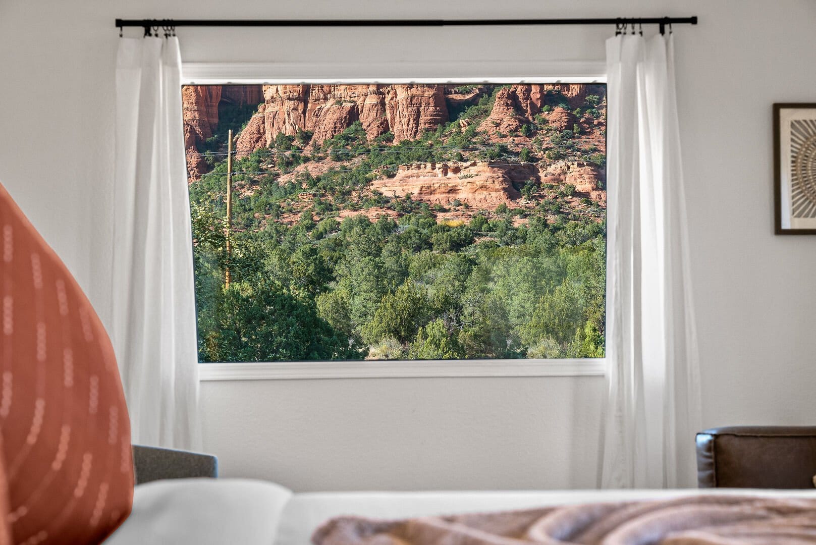 Window view of red rock landscape.