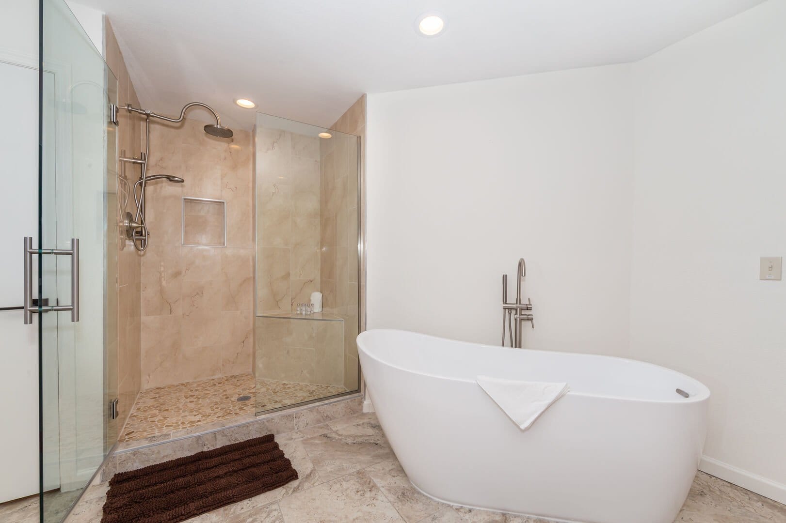 Modern bathroom with tub and shower.