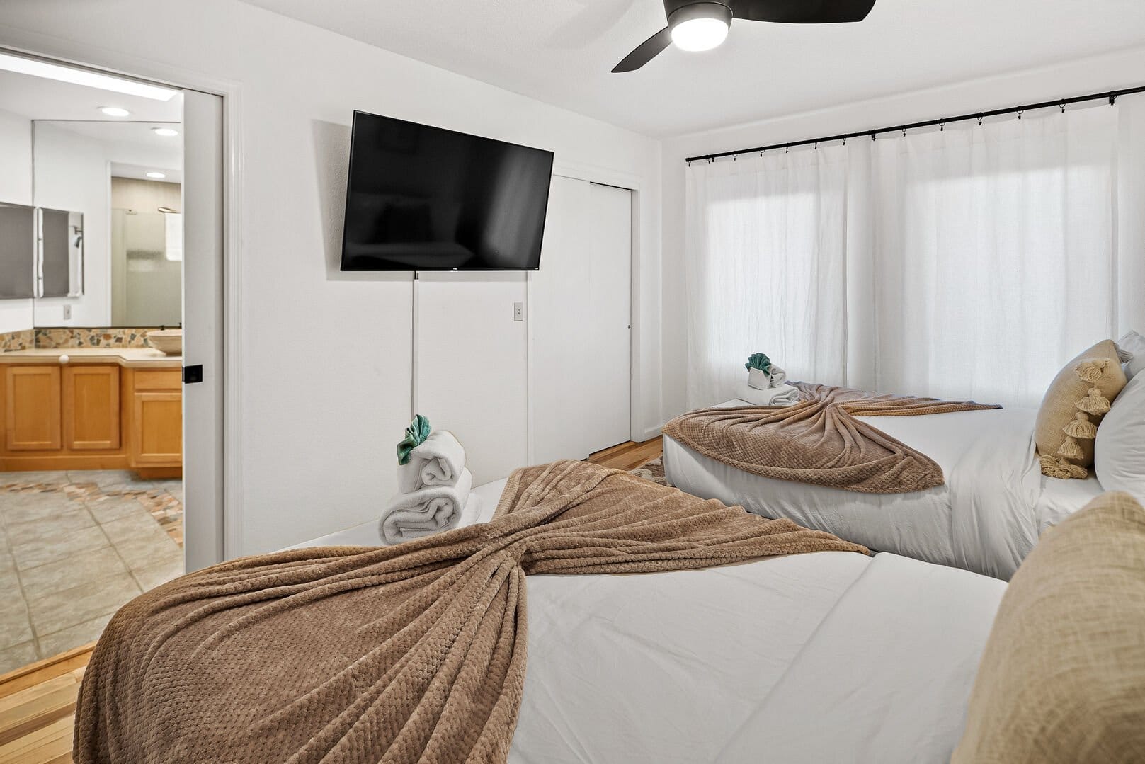 Modern hotel room with two beds.
