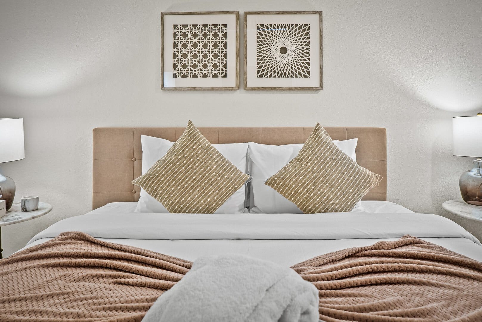 Cozy bedroom with decorative pillows.