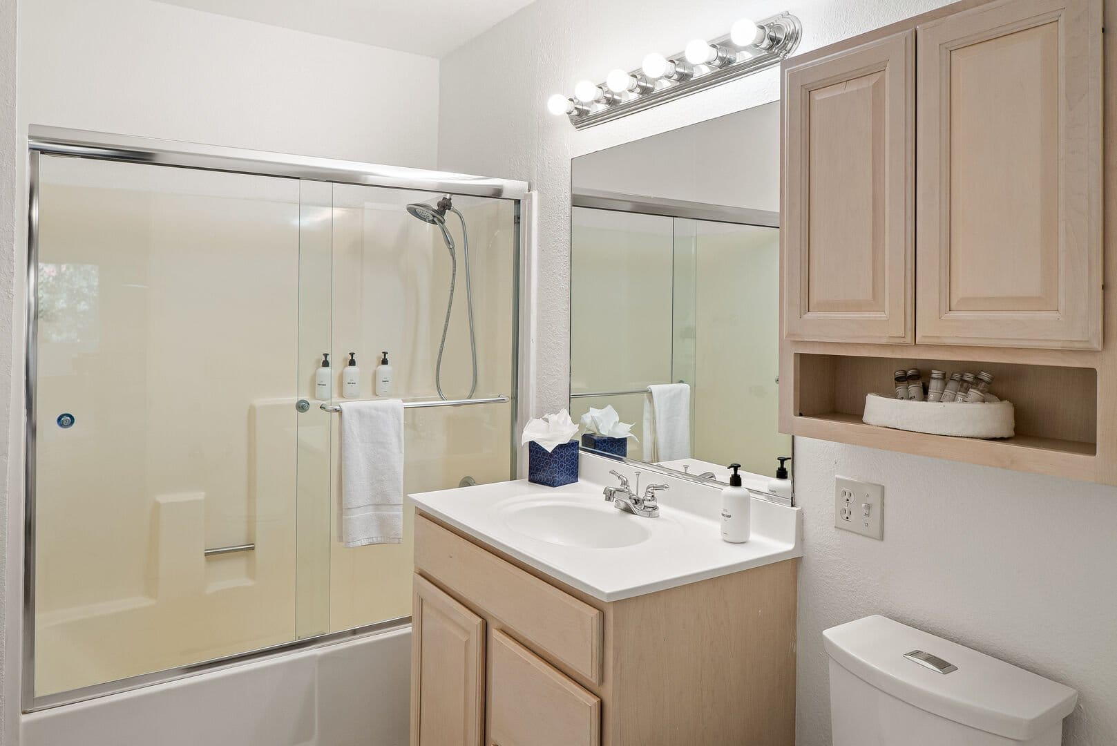 Modern bathroom with shower and vanity.