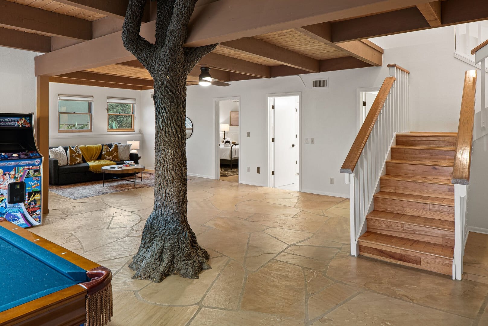 Room with tree trunk feature.