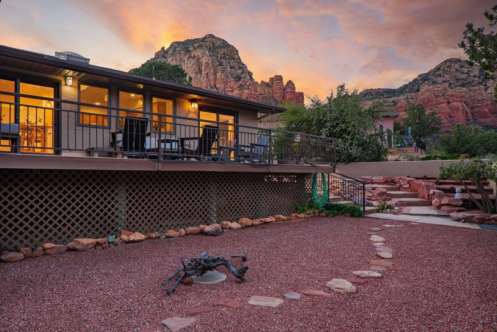 House with mountain views at sunset.