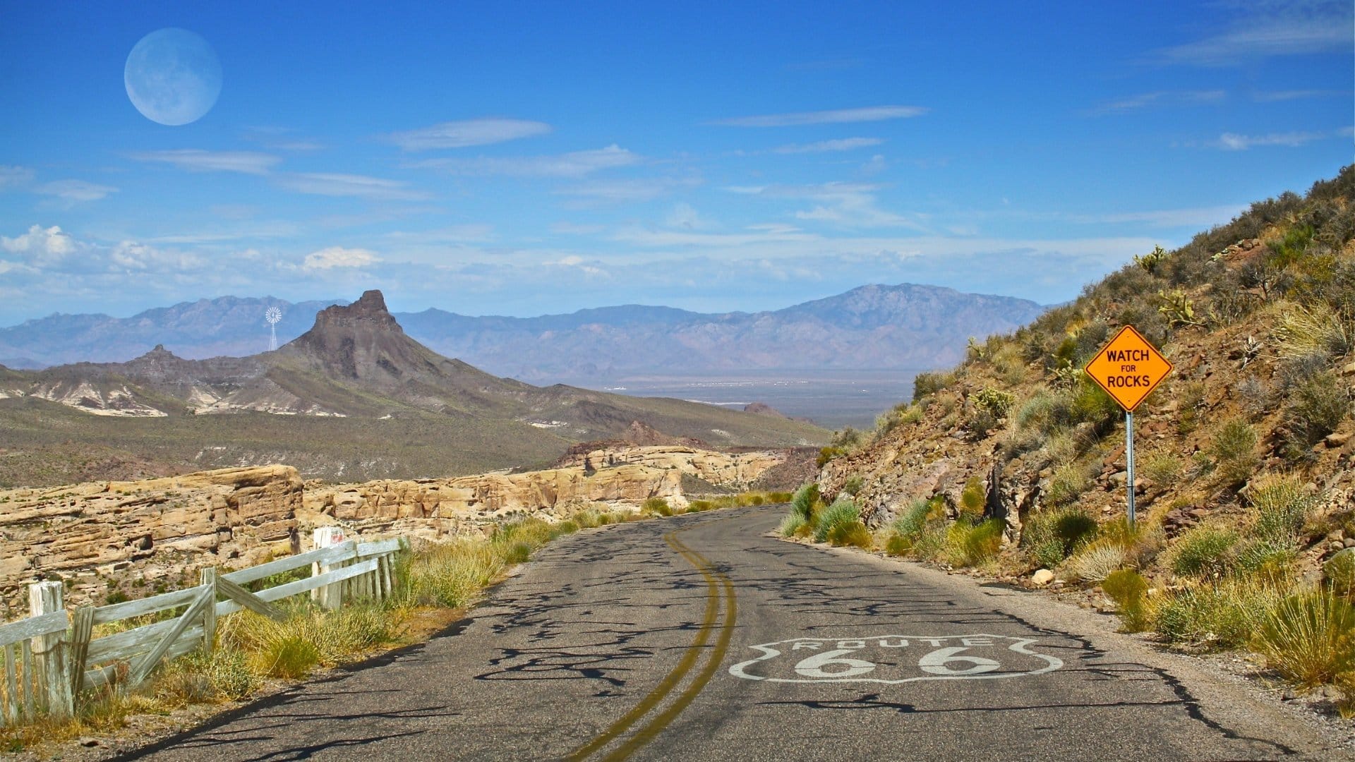 Route 66 desert road, rocks warning.