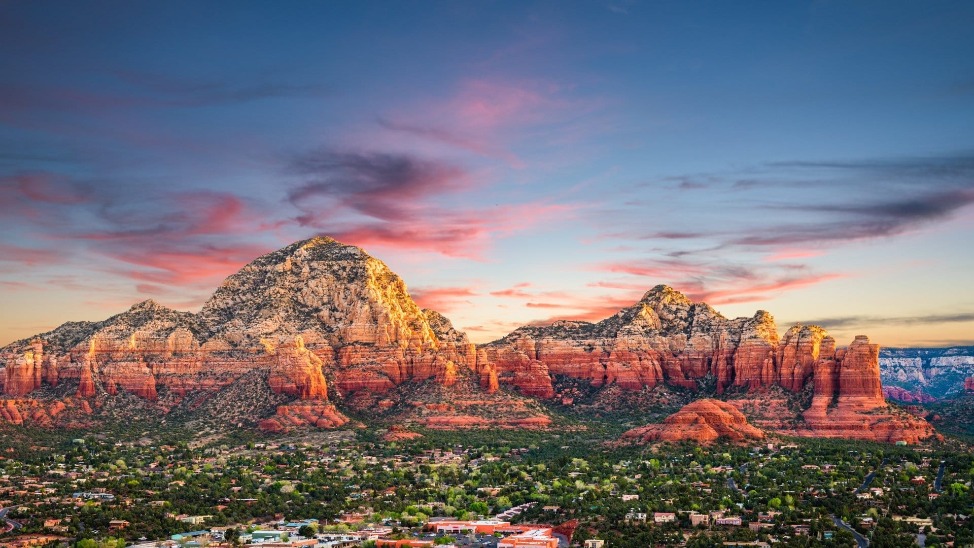 Colorful sunset over red rock formations.