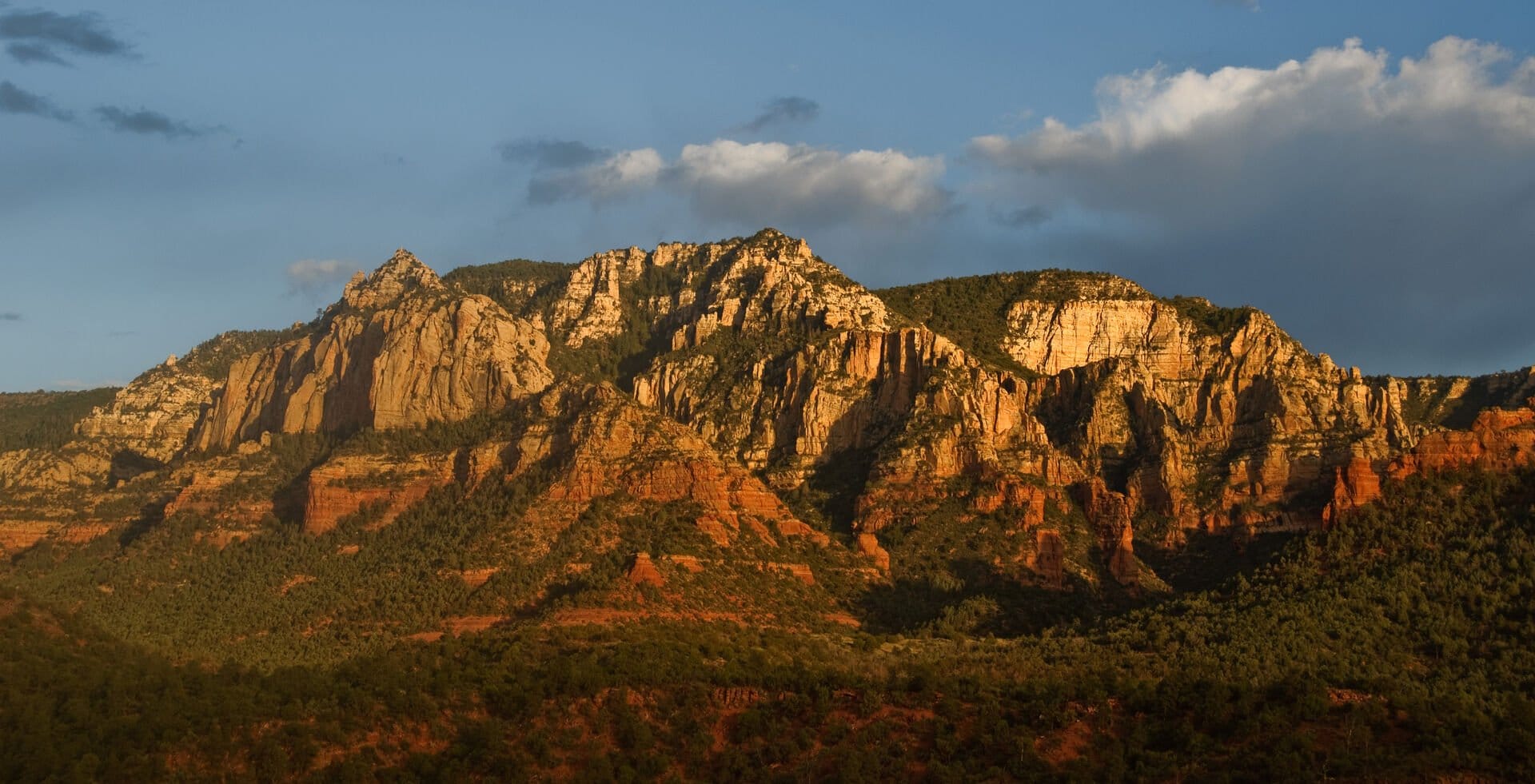 Sunlit rugged mountain landscape.