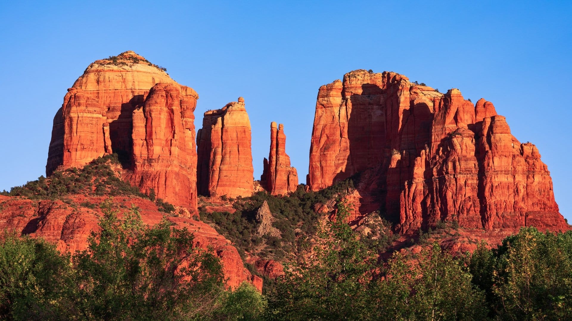 Red rock formations against sky.