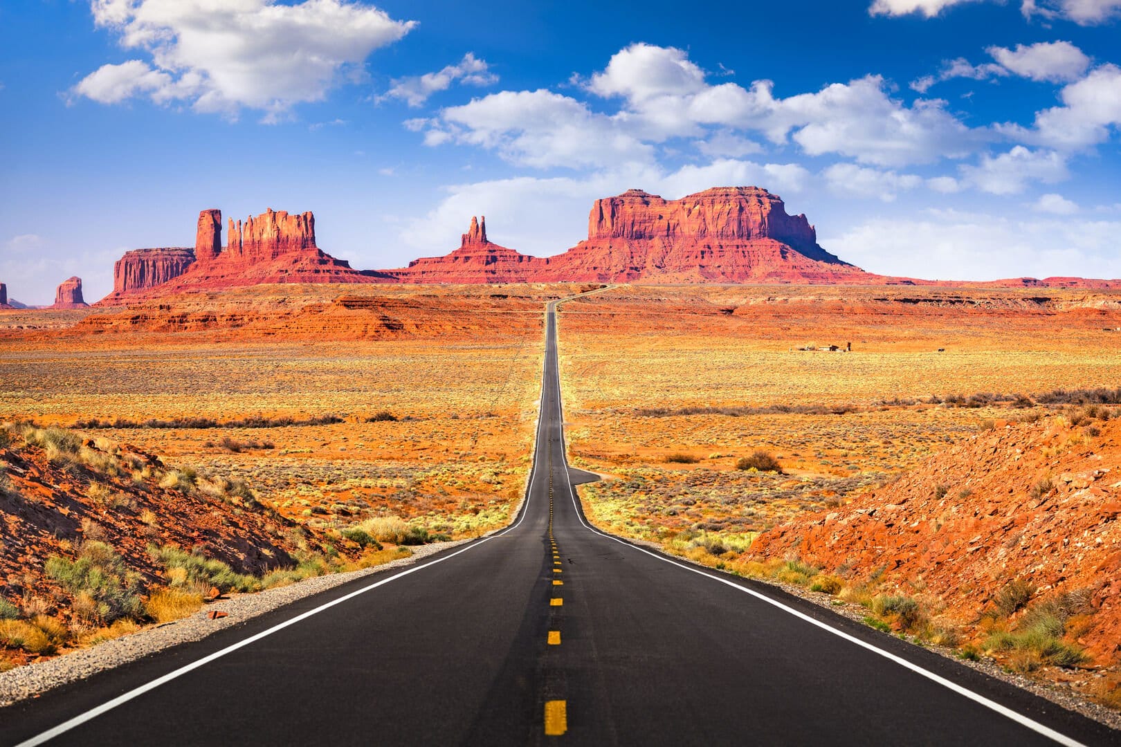 Desert highway leading to mesas.