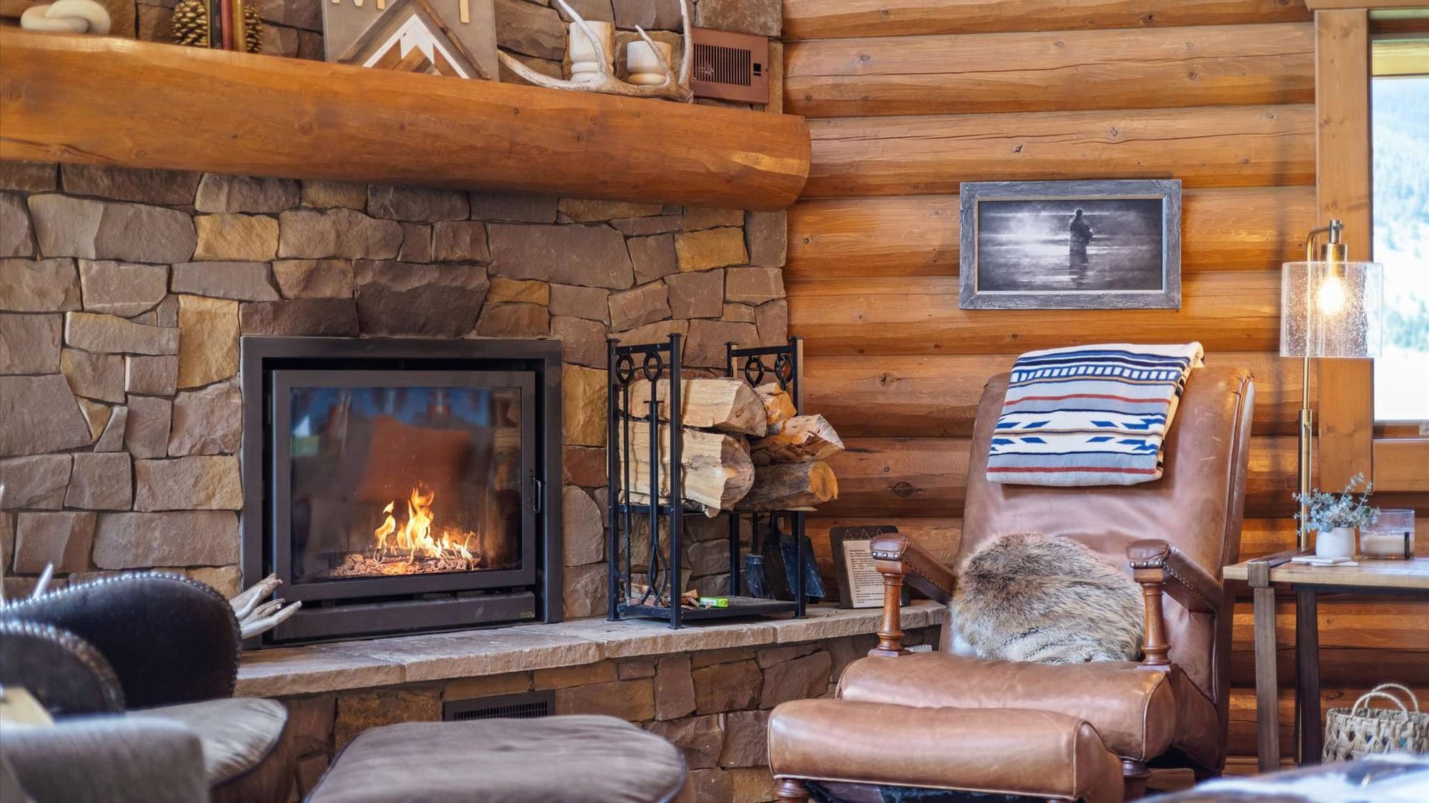 Cozy cabin interior with fireplace.