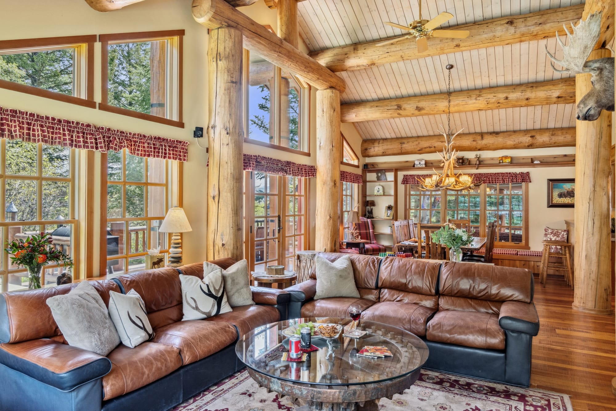 Rustic living room with log beams.