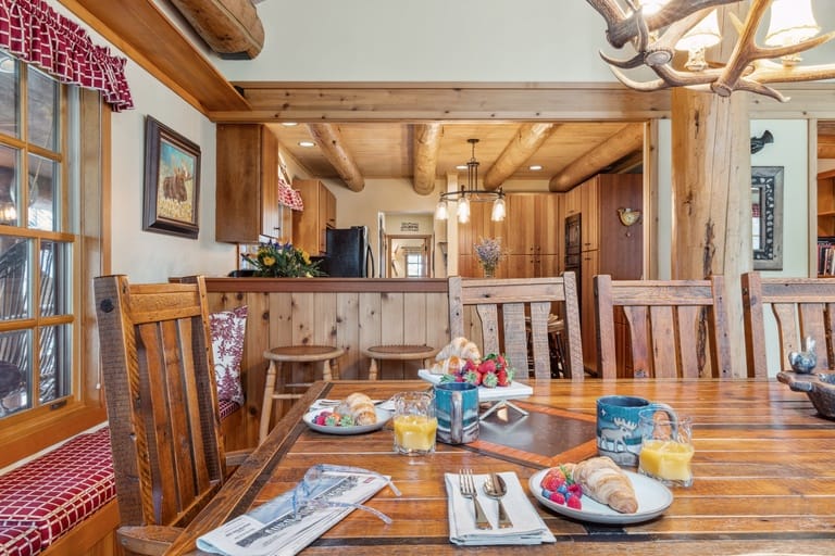 Rustic dining room with breakfast setup.
