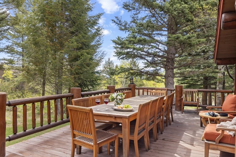 Wooden deck with dining table.