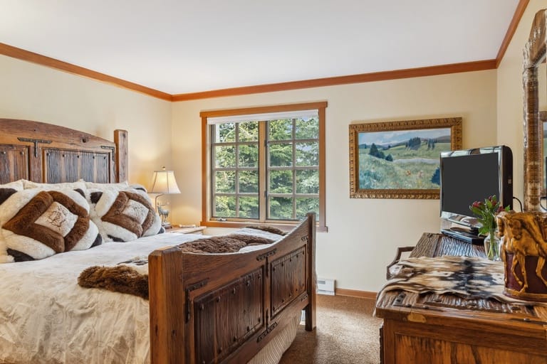 Rustic bedroom with wooden furniture.