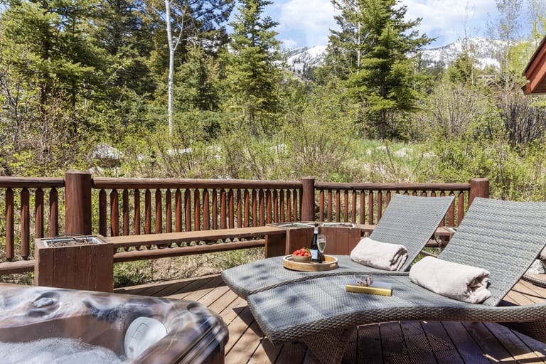 Deck with loungers and jacuzzi.