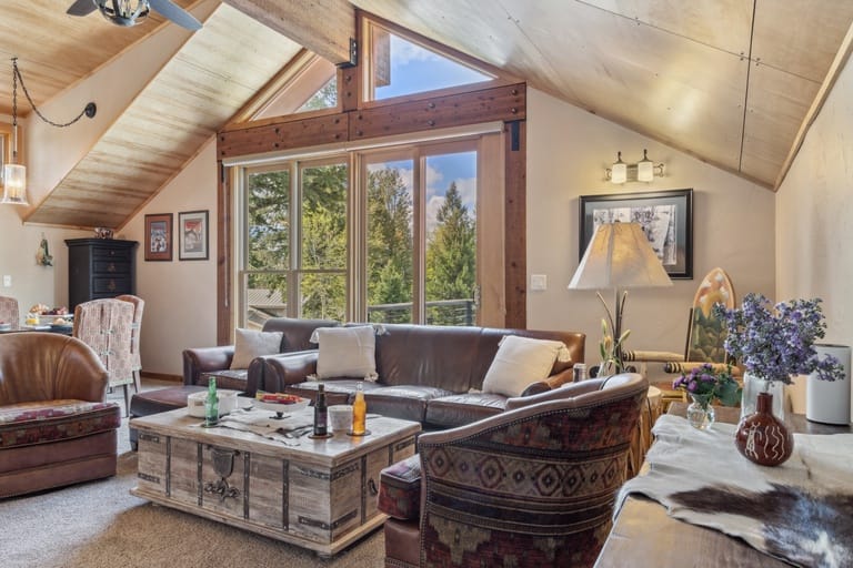 Cozy rustic living room with windows.