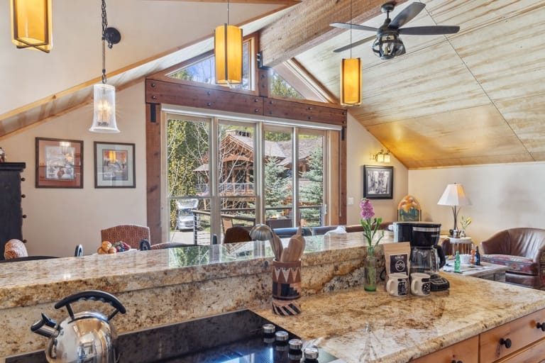 Cozy kitchen with cabin view.