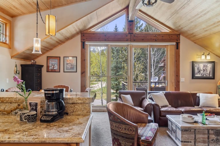 Cozy cabin living room, big window.