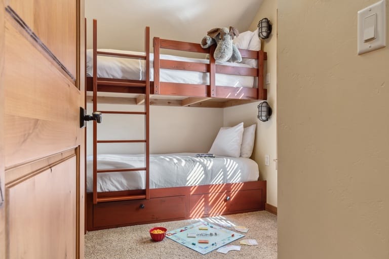 Bunk beds with a board game.
