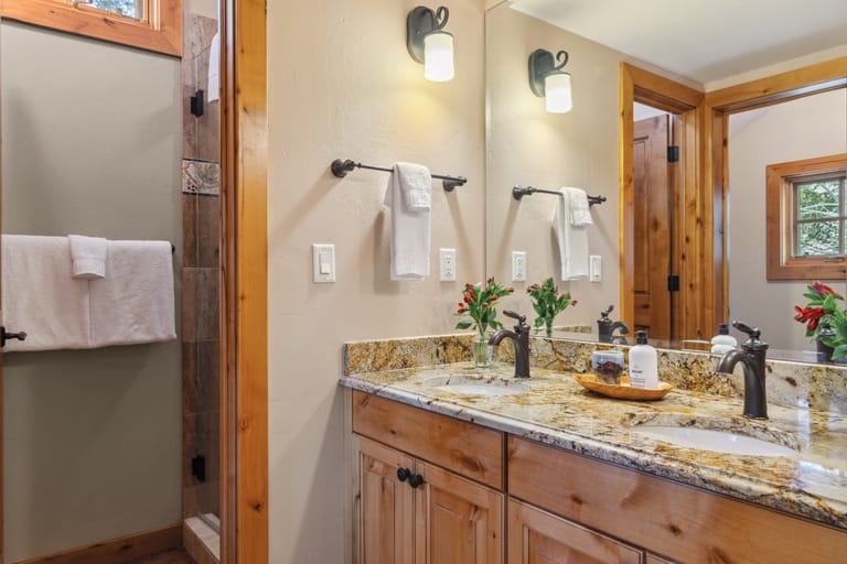 Rustic bathroom with double sink.