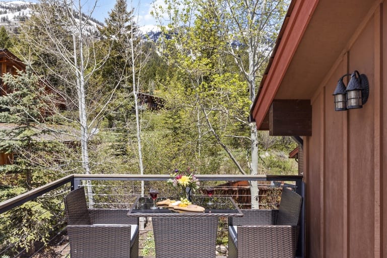 Mountain balcony with outdoor dining.