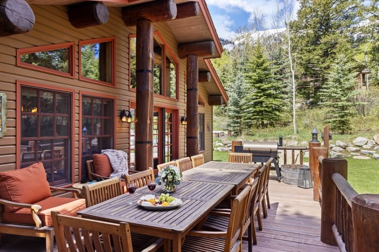 Wooden patio with outdoor dining area.