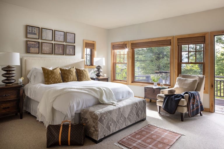 Cozy bedroom with large windows.