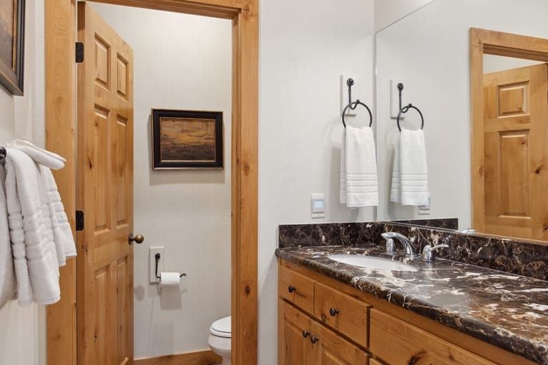 Rustic bathroom with wooden accents.